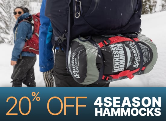 4Season sale banner, 20% off select four season hammocks. Image is two hikers in the snow, with the back of one hiker showing a packed hammock in the foreground, and a person in the background looking back and smiling.